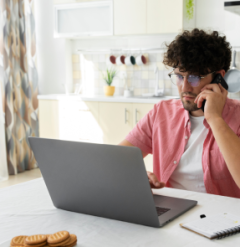 A virtual assistant talking to a client over the phone regarding social media campaign.